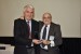 Dr. Nagib Callaos, General Chair, giving Prof. Tomas Zelinka an award "In Appreciation for Delivering a Great Keynote Address at a Plenary Session."